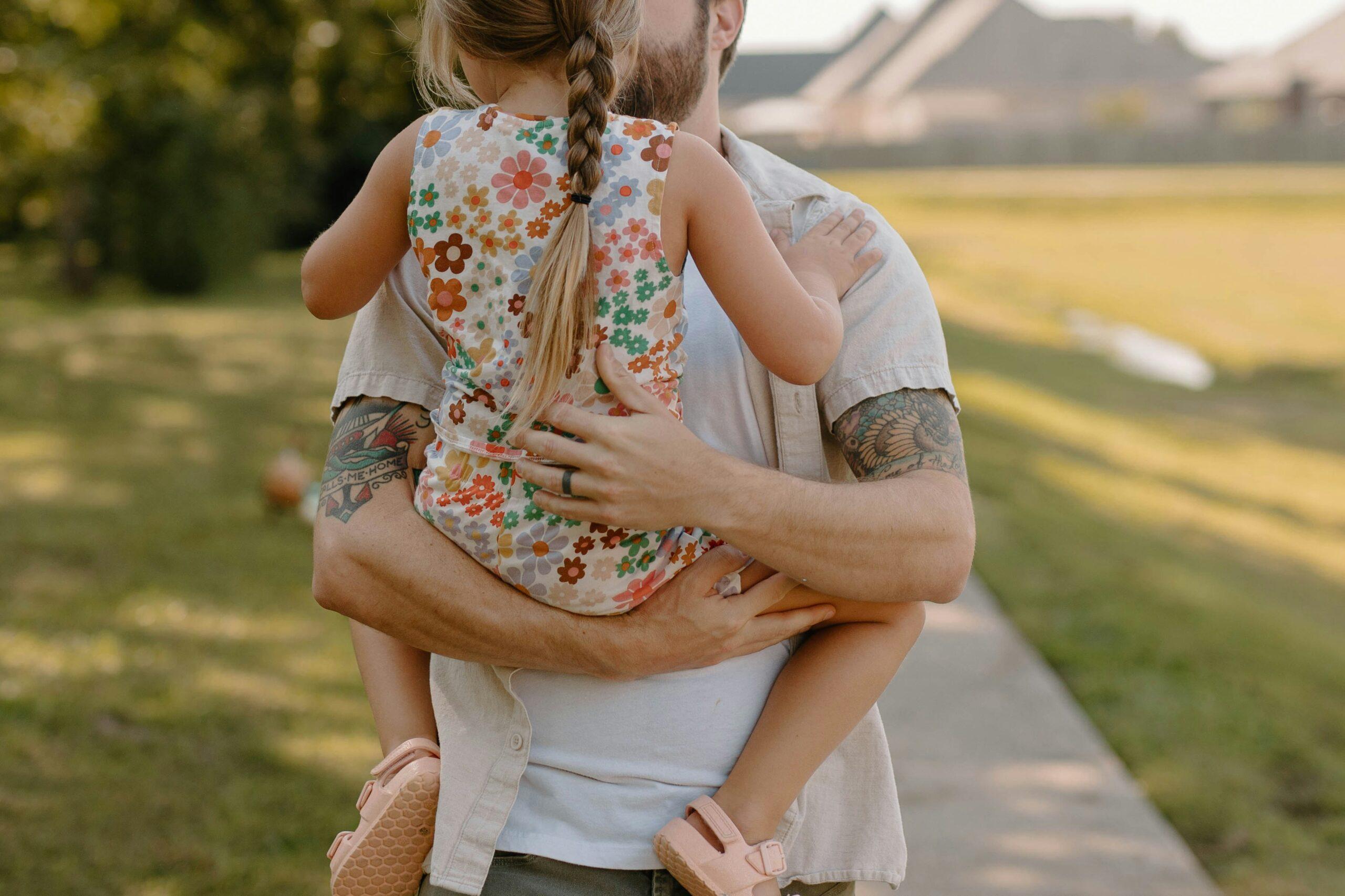 father with daughter in park